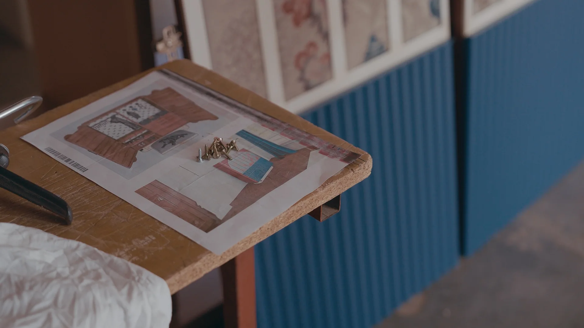 Sunna’s drawings on the bench, beside its fluted blue front